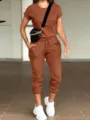 Lässiges Damen Zweiteiler Set mit einfarbigem Kurzarm-Top und Taschen-Jogginghose. - S / Set / Orangerot