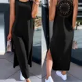 Robe longue noire sans manches fendue avec un design en dentelle ajourée pour la mode d'été. - L / Robes / Noir