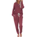 Detailed view of the women's waffle knit long sleeve henley top and drawstring lounge pants set. - Red
