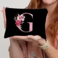 Black canvas cosmetic bag featuring pink floral letter G, ideal for daily makeup storage. - Letter G Style(7) / Black