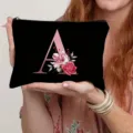 Canvas cosmetic bag with letter A and floral print detail for daily storage and travel use. - Letter A Style(1) / Black