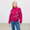 Detail view of women pink mock neck knit sweater featuring silver embroidery and long sleeves. - One Size / Tops / Deep Pink