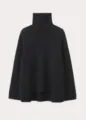 Detailed view of the women black turtleneck sweater, showing soft loose knit texture. - One Size / Black