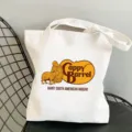 Close-up detail of white canvas tote bag with cute capybara graphic print on chair. - Style 3 / 35*40cm