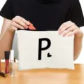 Custom zipper cosmetic bag with stylish letter print, portable makeup storage pouch for travel. - Style P