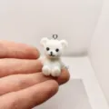Close-up of a cute white flocked mini bear pendant, perfect for DIY jewelry making and charms. - White