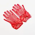 Red mesh lace fingerless gloves detail featuring elegant satin bows and decorative beads. - Red