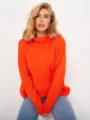 Close-up detail of women's cozy loose orange turtleneck knit sweater, soft winter wear. - S / Tops / Orange Red