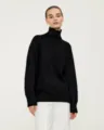Classic black turtleneck sweater detail view, showcasing soft knit fabric and comfortable loose fit. - S / Tops / Black