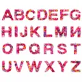 Resin alphabet letter pendant detail, colorful shell glitter DIY jewelry accessory close up. - Rose Red Shell