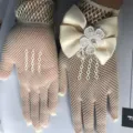 White lace fishnet gloves with satin bow pearl decoration for kids wedding party. - Beige