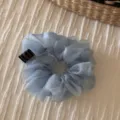 Light blue organza scrunchie detail view, soft sheer mesh hair tie close-up for women. - Blue