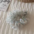 Floral organza scrunchie detail view, soft sheer hair tie with elegant floral pattern, chic accessory. - Organza Small Floral Ring - Beige Green