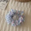 Close-up of vintage floral organza hair scrunchie, elegant sweet hair tie accessory for women. - Organza Small Floral Ring - Blue Pink