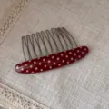 Red polka dot acetate hair comb detail shot, elegant metal teeth insert clip for daily hairstyling. - Red Polka Dot