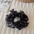 Dark floral organza scrunchie detail close-up showcasing fluffy texture and elegant retro style. - Organza Small Floral Ring - Black