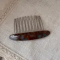 Detail view of exquisite acetate hair insert comb, tortoise shell design, elegant hair accessory. - Blue Brown