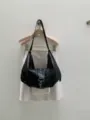 Black soft leather hobo shoulder bag detail, vintage slouchy dumpling bag with star studs. - Black