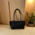 Black woven shoulder bag for women, stylish casual tote bag with chic cutout design for daily use. - Black