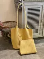 Yellow woven leather tote bag and pouch detail view showing intricate texture and design. - Yellow