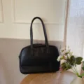 Detailed view of the black minimalist shoulder tote bag, casual large capacity design for daily use. - Classic Black