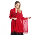 Close up detail view of elegant red chiffon shawl featuring delicate lace fringe and drape. - Burgundy