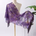 Close up of purple sequin embroidered fringe shawl with intricate peacock mesh fabric details. - Deep purple
