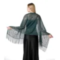 Detailed view of elegant dark green lace shawl with floral design and delicate fringe trim. - Dark Green