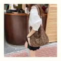 Detail view of the stylish leopard print canvas shoulder bag, large capacity casual tote design. - Dark Leopard Print