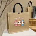 Jute tote bag with cute cartoon print and black handles, spacious daily shoulder bag for commute. - Starry Partners / L
