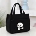 Close-up detail of the black canvas lunch bag with cute panda graphic and front pocket design. - Milk Bottle Panda Bento Bag / 25*16*22cm / Black