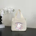 Detailed view of casual canvas tote bag with cute rabbit print and dual top handles. - 26x24x15.5cm / Cartoon Print / White