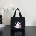 Casual black canvas handbag with cute rabbit graphic, large capacity daily commuting tote bag. - 26x24x15.5cm / Cartoon Print / Black
