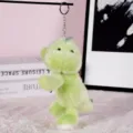Detailed shot of cute green plush dinosaur keychain, soft toy pendant with metal ring. - Green Dinosaur (Round Buckle)