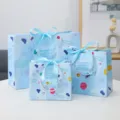 Blue gift paper bags with cute cartoon star and planet print, elegant ribbon bow handles. - 075 Blue Ribbon - Small