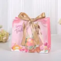 Roze papieren geschenkzak met gouden lint, ideaal voor cadeaus voor Lerarendag en bloemen. - S / Roze