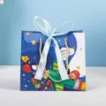 Children's Day gift paper bag with ribbon bow and handles for toy snack packaging. - Cartoon 0126 (Blue Ribbon) - Small