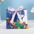 Children's Day gift bag with cartoon airplane pattern, cute pink ribbon bow, and golden handles. - Cartoon 0126 (Pink Ribbon) - Small