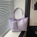 Chic purple leather tote bag for women with silver glitter butterfly patterns and mini pouch. - Purple