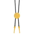 Western bolo tie featuring a black braided leather cord and a striking gold floral metal pendant. - Patterned Round