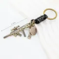 Creative metal rifle model keychain with leather strap for car keys and bags detail view - Black Leather Style