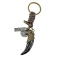 Detalle del llavero retro de diente de lobo con cuerda de cuero trenzado y metal. - Como se muestra / Cabeza de Lobo Negra