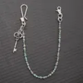 Vintage metal wallet chain with colorful beads, detailed shot of hip hop rock pants accessory. - Silver