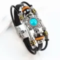 Primer plano de pulsera de cuero multicapa con flor turquesa y cuentas de metal mixtas. - Turquesa Redonda / Negro