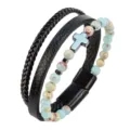 Pulsera de cuero multicapa con correas trenzadas, cuentas de piedra y un dije de cruz. - Jaspe Imperial Azul