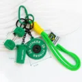 Mini fitness keychain with dumbbell shaker bottle and barbell plate pendants for bags. - Green