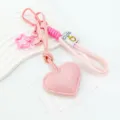 Llavero de cuero con corazón rosa de moda con cuerda trenzada, colgante de estrella y campana. - Rosa