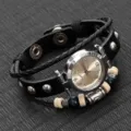Close-up of vintage black leather wrap bracelet watch with wooden beads and quartz dial. - Black