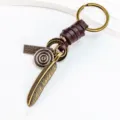 Llavero de cuerda de cuero vintage pluma acabado bronce antiguo colgante creativo de bolso regalo - Estilo Simple