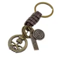 Vintage braided leather keychain featuring metal palm tree badge and engraved charm pendant. - Coconut Tree Style